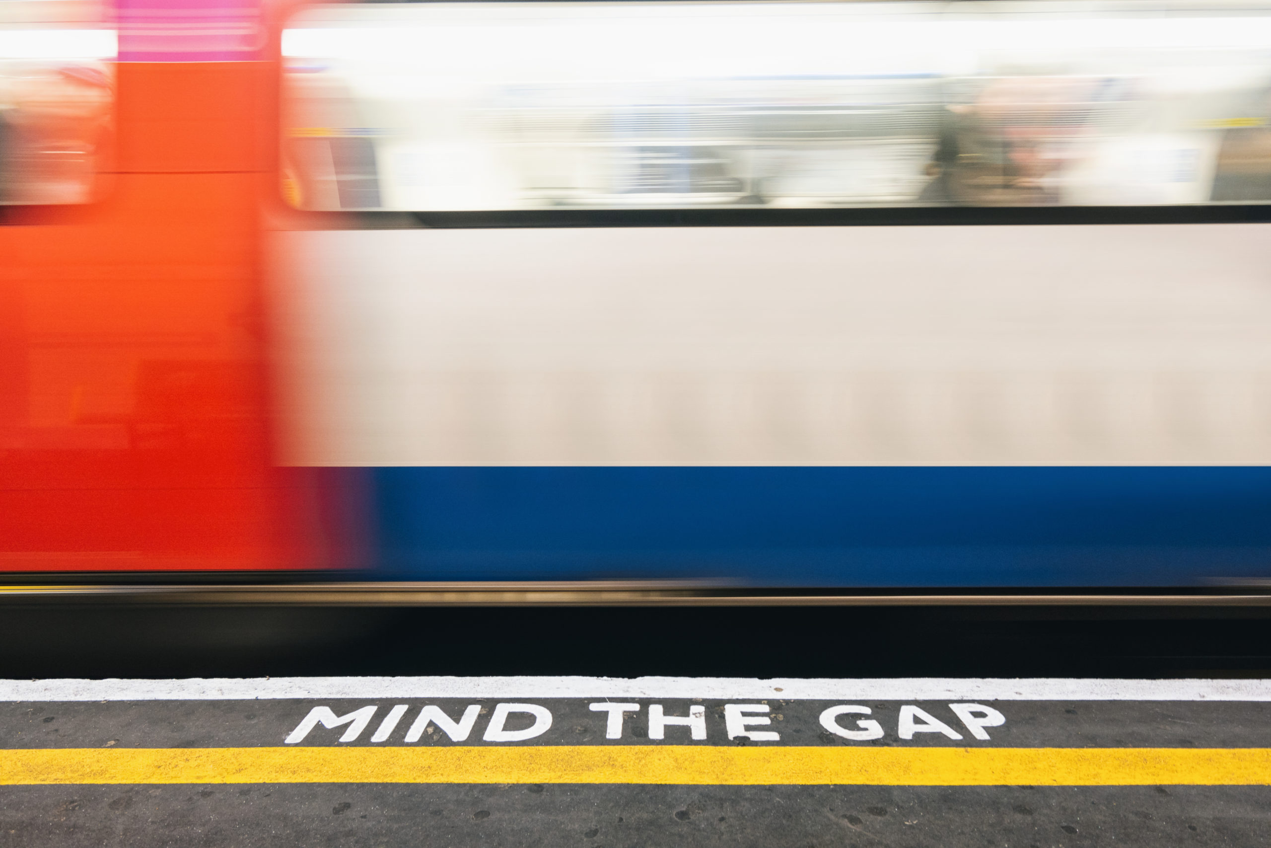 Mind the Gap marking beside a London Underground train