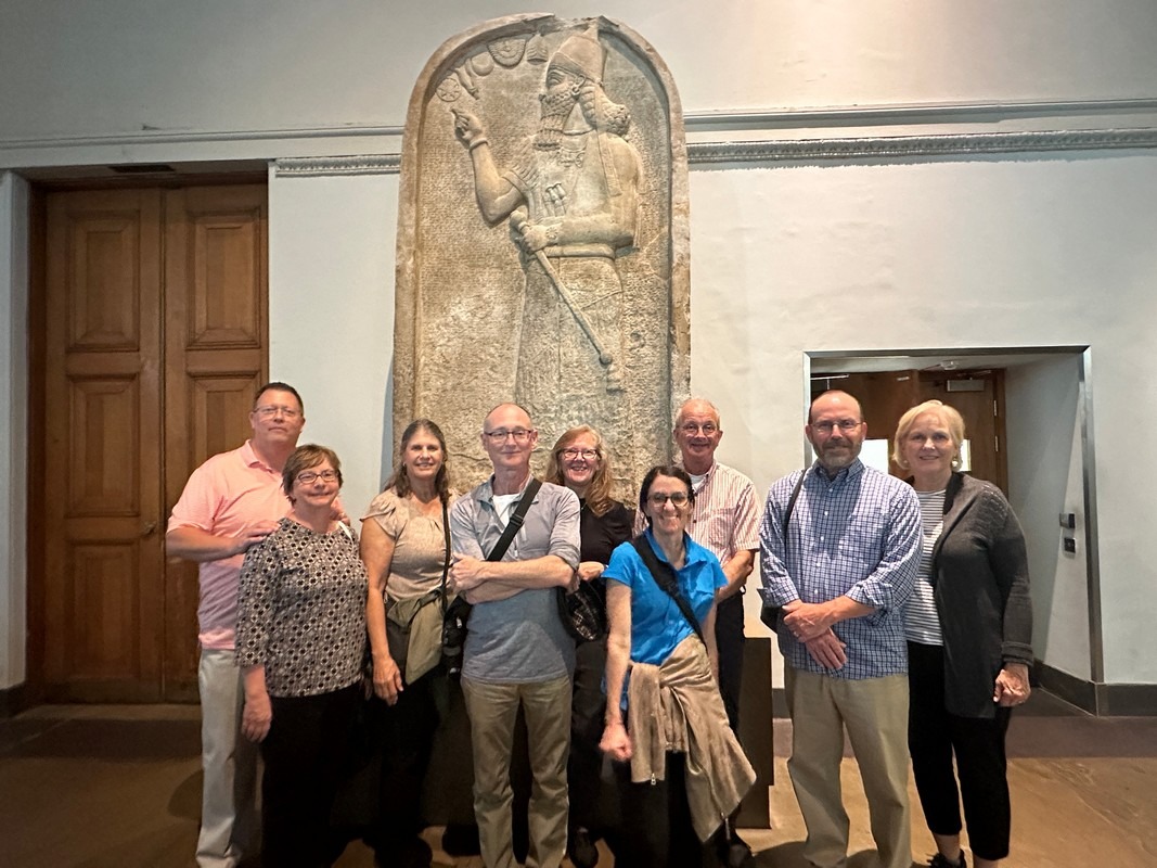 London Christian Tours group with the stela of Ashurnasirpal II, British Museum 118805