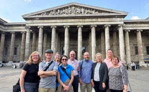 London Christian Tours group standing outside the columned entrance of the British Museum