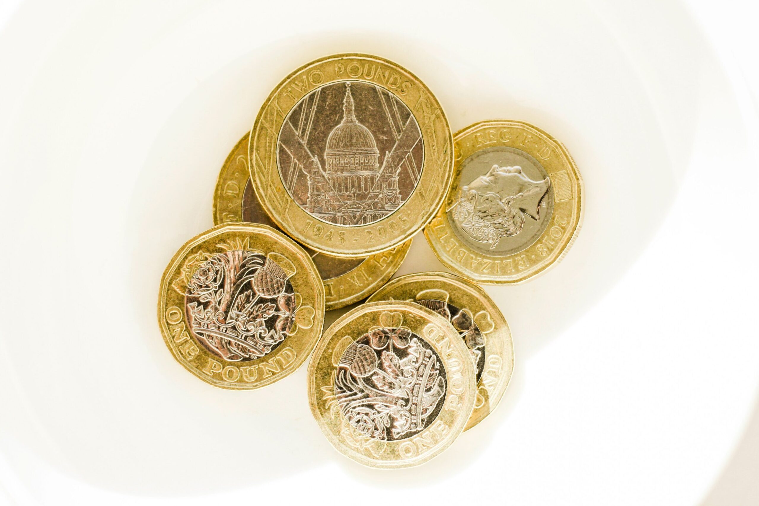 British one-pound and two-pound coins including the modern bimetallic one-pound design