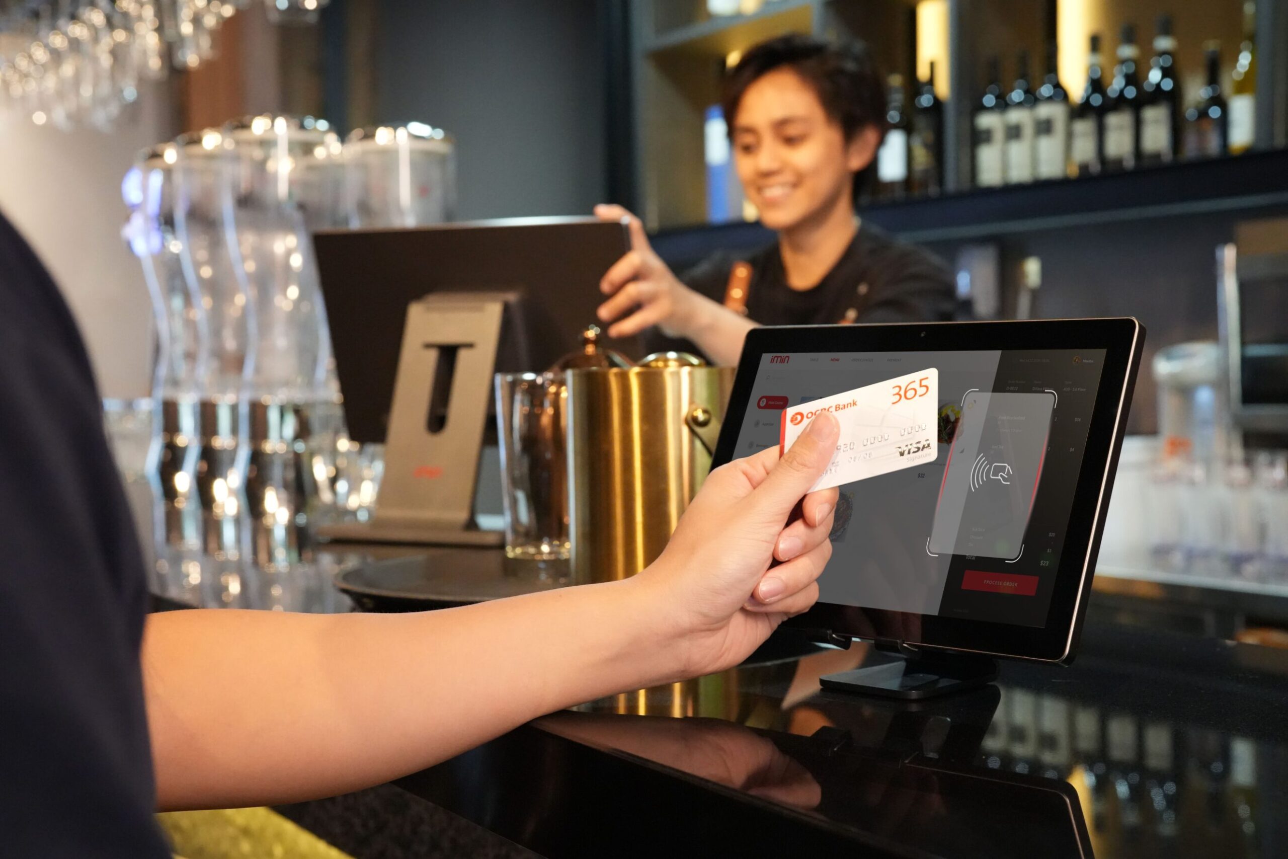 Traveler using a contactless credit card at a payment terminal