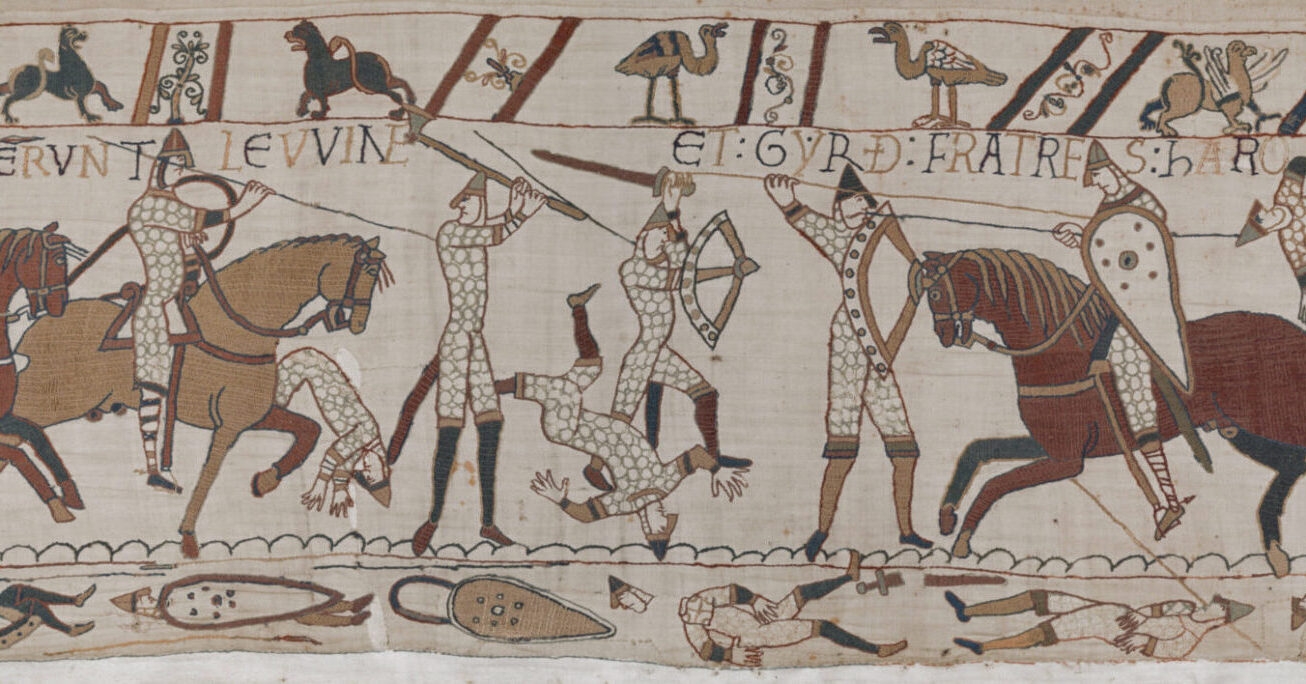 Bayeux Tapestry battle scene showing mounted warriors and fallen figures during the Battle of Hastings